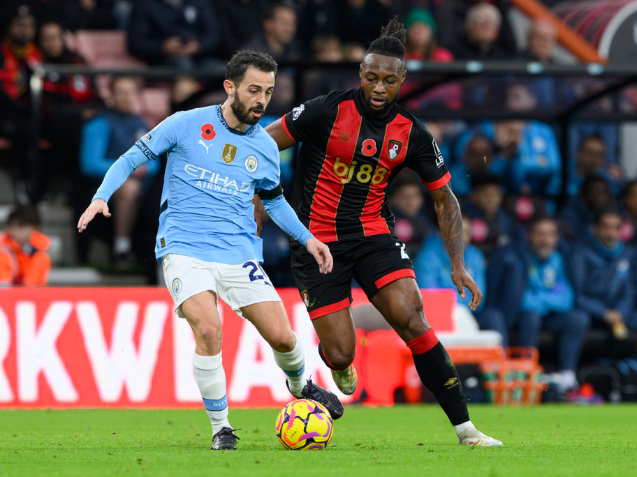 IMAGO Manchester City Bernardo Silva and Bournemouth's Antoine Semenyo jostle for the ball at the Vitality Stadium