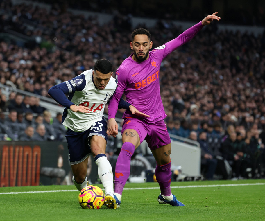 IMAGO Wolves forward&nbsp;Matheus Cunha and Tottenham defender Pedro Porro jostle for the ball at the Tottenham Hotspur Stadium