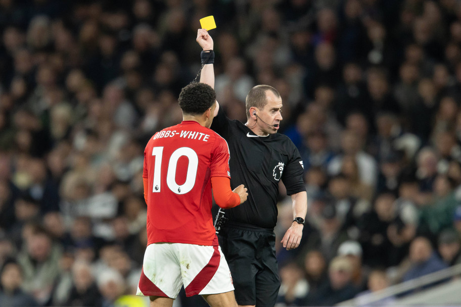 IMAGO Morgan Gibbs-White receives a yellow card from Premier League referee Peter Bankes
