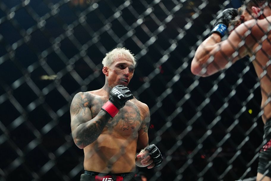 IMAGO Charles Oliveira (centre) beat Michael Chandler by decision at UFC 309 in November 2024