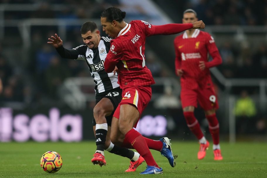 IMAGO Bruno Guimaraes (left) and Virgil van Dijk (right) battle for control at St. James' Park earlier this seaso