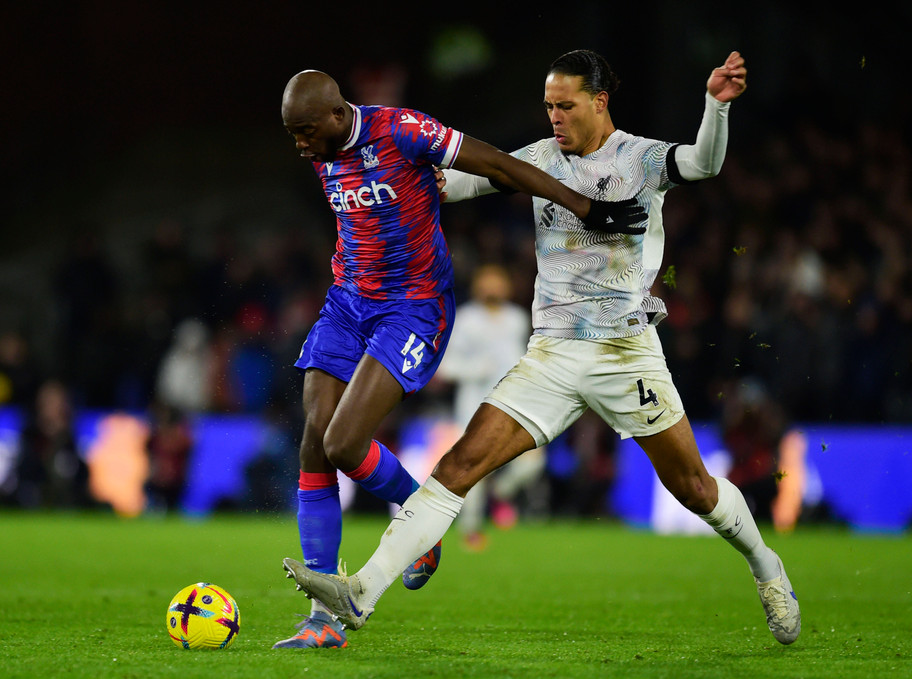 IMAGO Jean-Phillipe Mateta and Virgil van Dijk challenge for the ball.