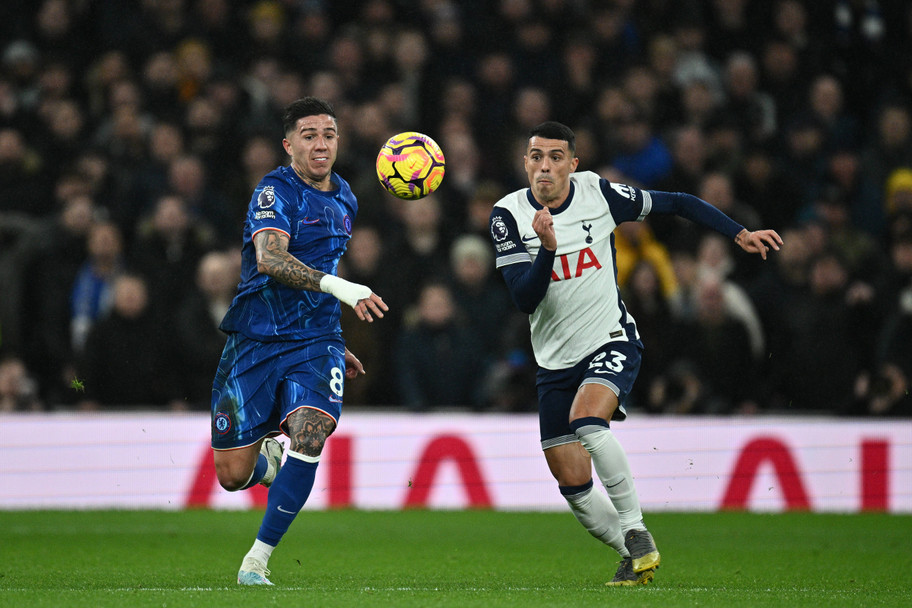 IMAGO Chelsea's Enzo Fernandez and Tottenham's Pedro Porro fight for possession in 2024
